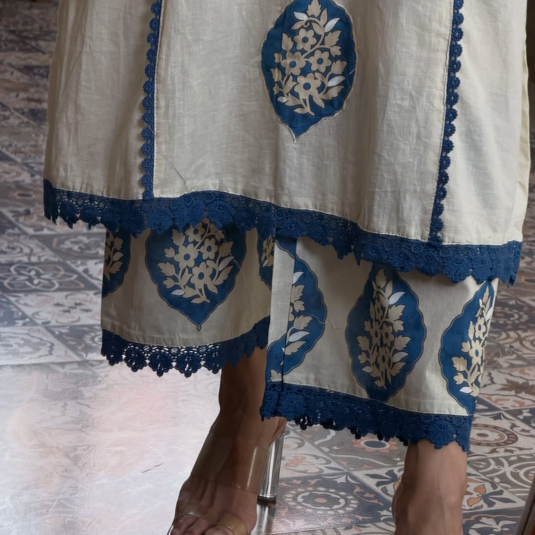 Indian 3 piece cotton kurta pant dupatta set for women
White blue ethnic kurta set for women with printed dupatta
Women’s Indian cotton suit in white and blue with wide leg pants
White and blue kurta pant set for festive and casual wear