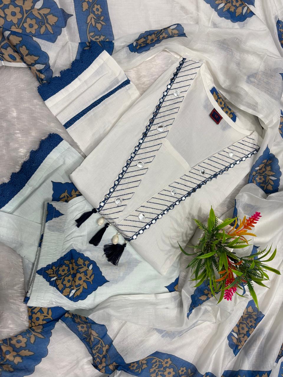 Indian 3 piece cotton kurta pant dupatta set for women
White blue ethnic kurta set for women with printed dupatta
Women’s Indian cotton suit in white and blue with wide leg pants
White and blue kurta pant set for festive and casual wear